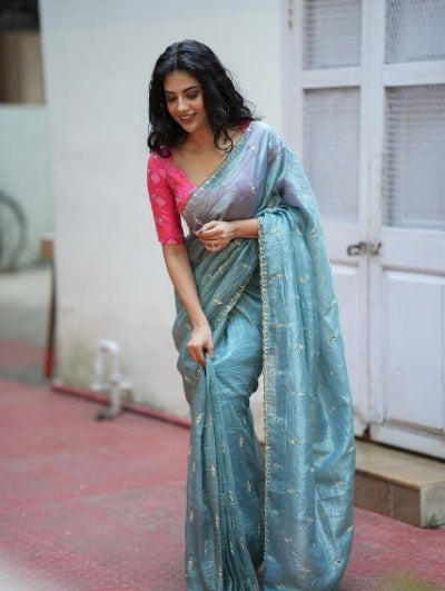 Gold tissue crush saree with mirror work blouse