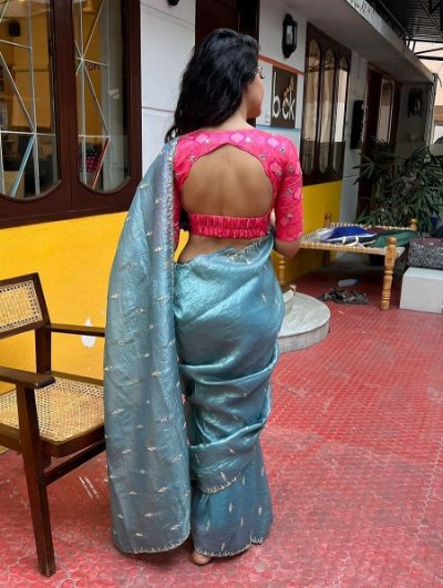 Gold tissue crush saree with mirror work blouse